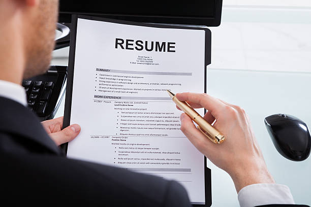 istock Businessman Analyzing Resume At Office Desk 516813183