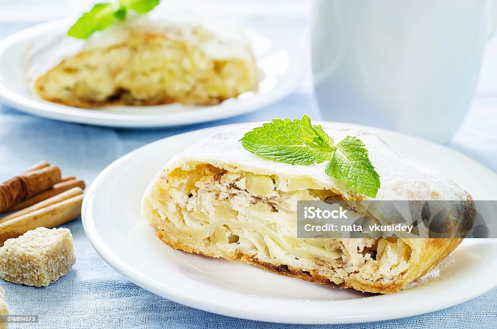 Apple strudel with cream cheese Apple strudel with cream cheese on a light blue background. tinting. selective focus mint Appetizer Stock Photo