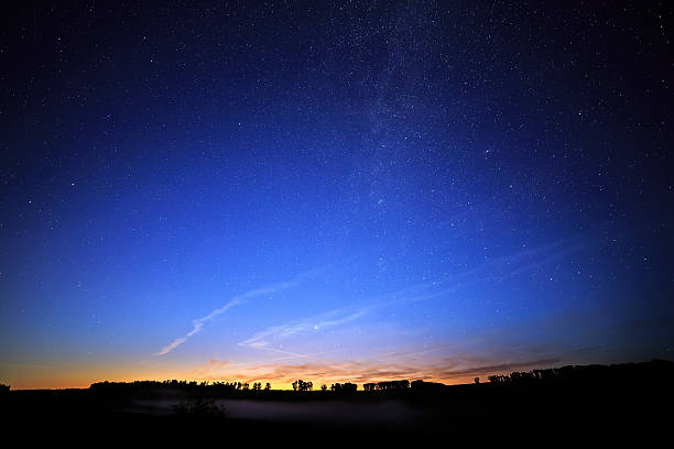 istock Dawn on a starry background sky and the Milky Way. 516814851