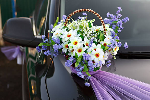 istock Decorating wedding car basket with flowers. 516814996