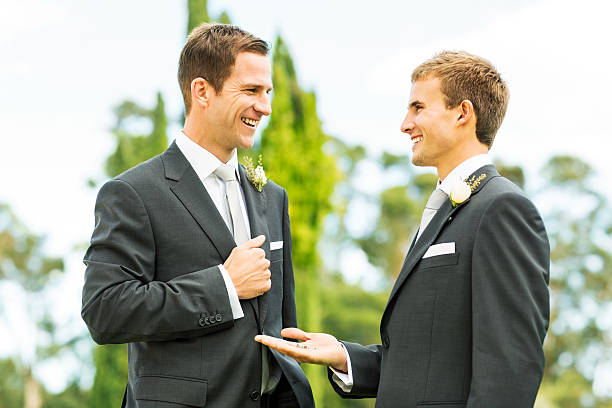 istock Best Man Looking At Groom While Showing Wedding Rings 516815881