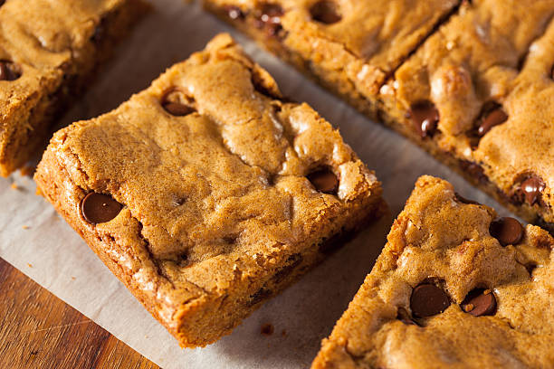 Homemade Chocolate Chip Blondies Homemade Chocolate Chip Blondies Cut Into Squares walnut cookies stock pictures, royalty-free photos & images