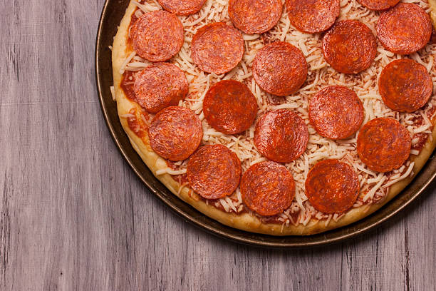 istock Pepperoni Pizza close up for backgrounds 516816232