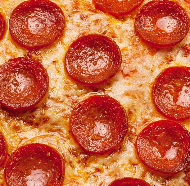 istock Pepperoci Pizza close up for backgounds 516816312