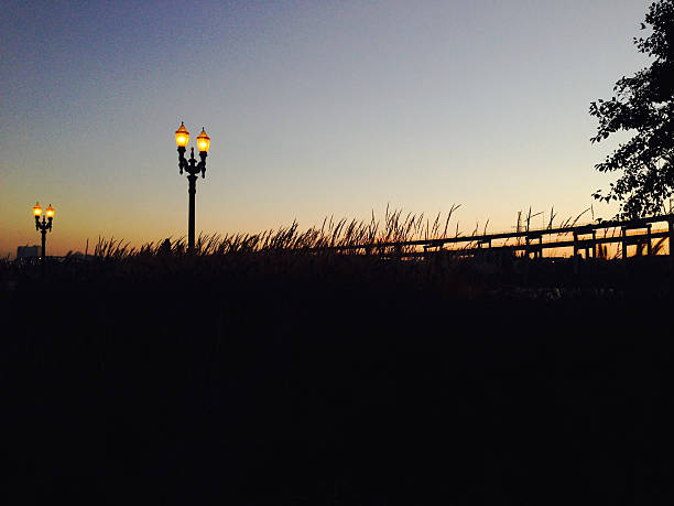 istock old-fashioned lamps lit at sunset 516816430
