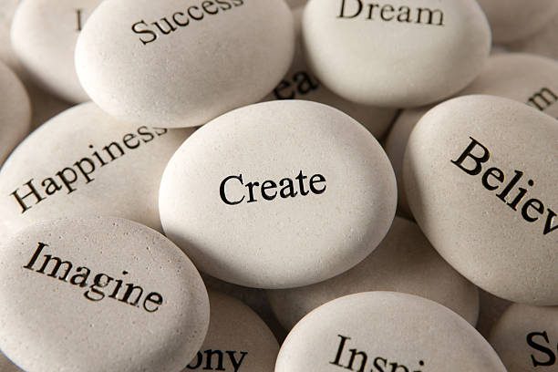 Inspirational stones - Create Close up of engraved stones motivation photos stock pictures, royalty-free photos & images