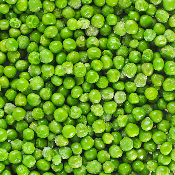 istock Shelled fresh ripe green peas 516817498