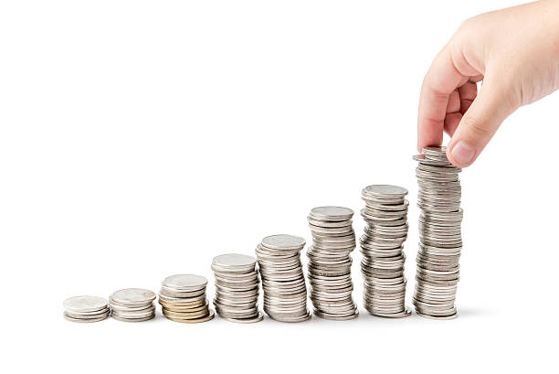 istock girl hand putting money coin stack growing business 516817810