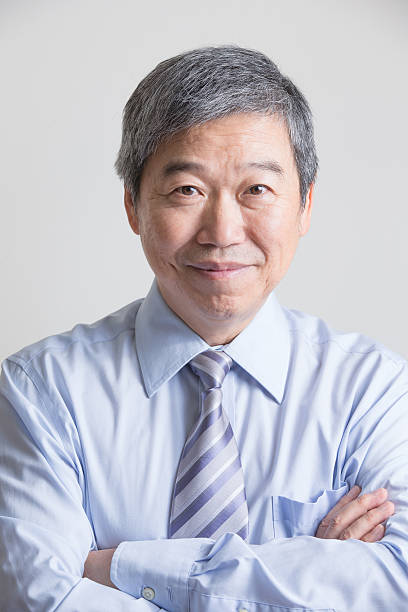 istock senior businessman with crossed arms 516820298