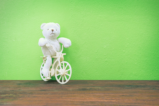 Teddy Bear Toy Riding Bicycle On Old Wood Stock Photo - Download Image ...