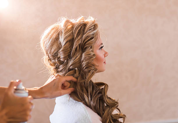 istock Wedding makeup artist making a make up for bride. Beautiful 516821858