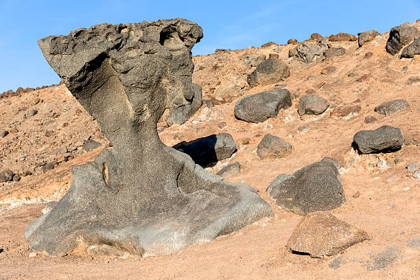 A view of the Mushroom Rock, on the east side of the road, 4.3 miles south of CA 190 in Death Valley National Park. This rock is what's left of an old basalt lava flow from a time when this region of the Black Mountains experienced volcanic activity.