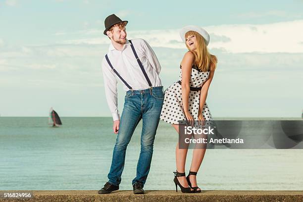 Loving Couple Retro Style Dating On Sea Coast Stock Photo - Download Image Now - Adult, Arts Culture and Entertainment, Beautiful People