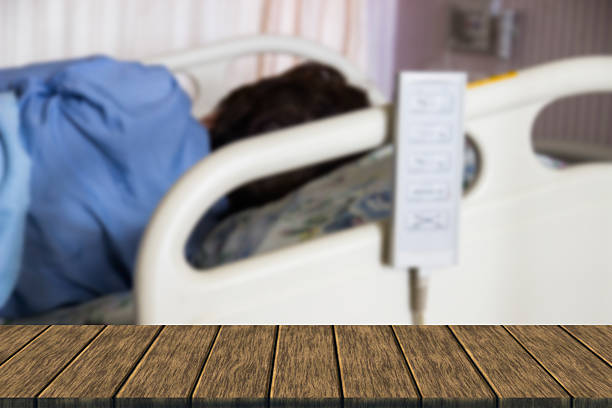 blurred image of Patient on bed in hospital for background