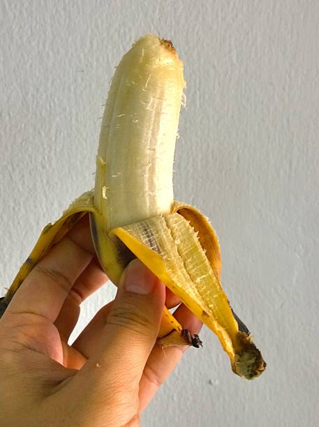 istock the banana in a hand 516825380
