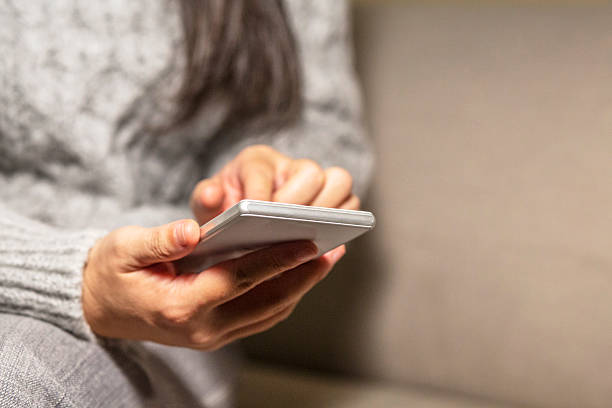 istock finger touching screen of smart phone 516826310