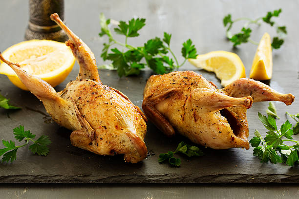 istock Delicious fried quail with herbs and greens. 516826848