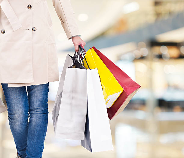 istock woman on a shopping spree 516827424