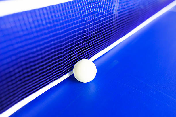 istock White Table Tennis Ball on a Blue Table 516842594
