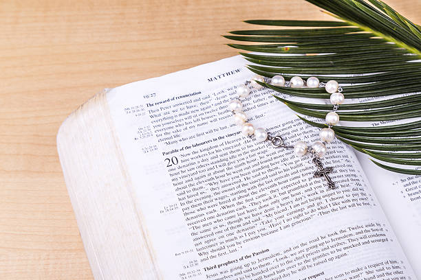 istock Closeup Catholic rosary with crucifix and beads on bible 516842612