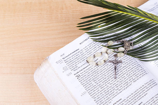 istock Closeup Catholic rosary with crucifix and beads on bible 516842674