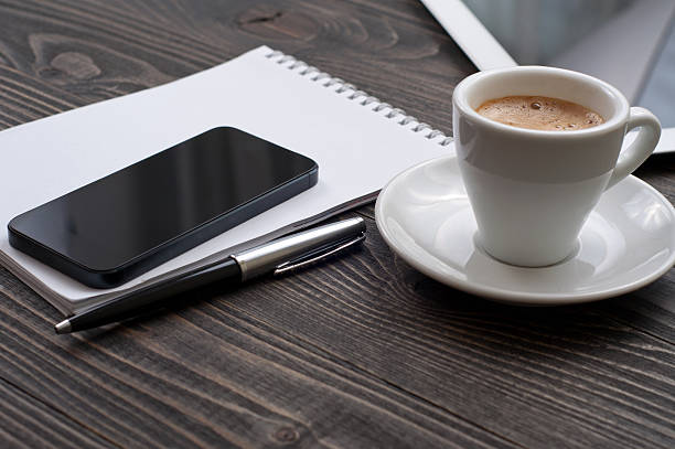 istock On the desktop the smartphone, notebook and cup of coffee 516843530