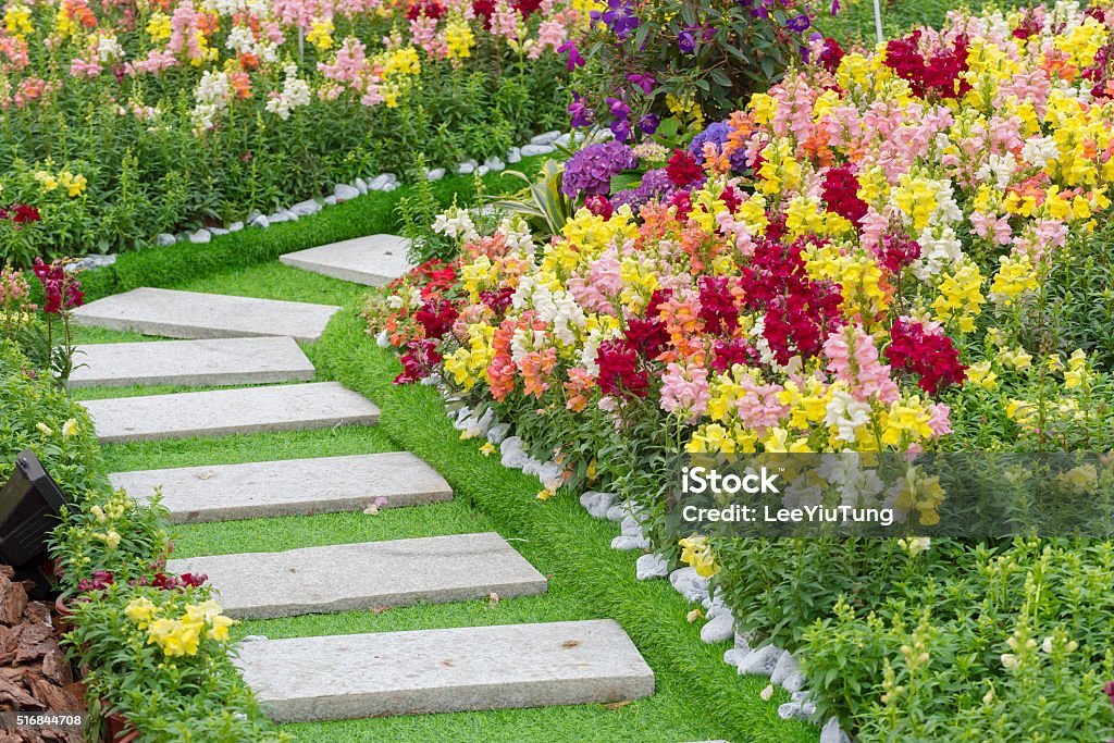 Path in garden Path in Ornate Flower Garden Yard - Grounds Stock Photo