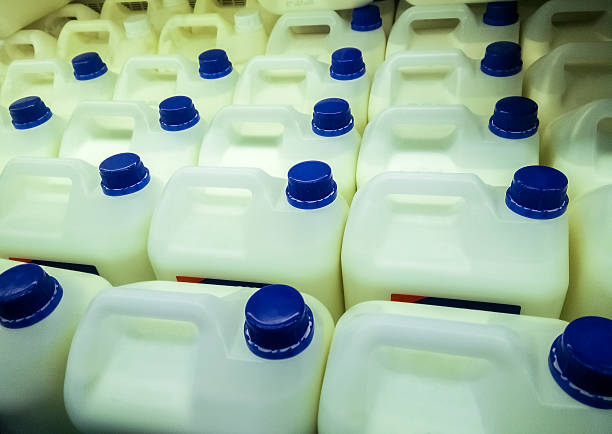 istock milk bottles on fridge shelf in supermarket store 516845574