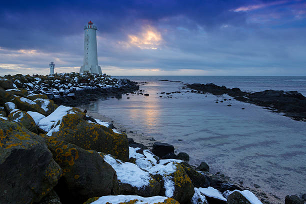 istock Beacon on an ocean coast during a sunset. Iceland 516847558
