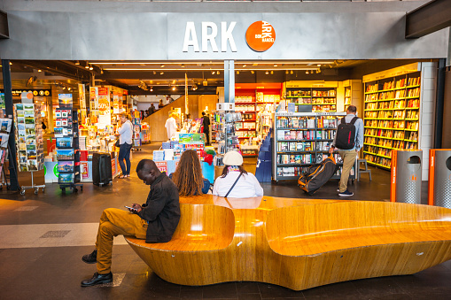 Oslo, Norway  - July 19, 2015: Book Store at Oslo Central Train Station, Norway. People shopping inside and sitting waiting outside the store
