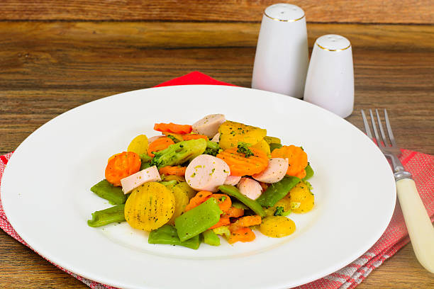 Steamed Vegetables Potatoes, Carrots, Corn, Green Beans and Onion with Sausage Studio Photo