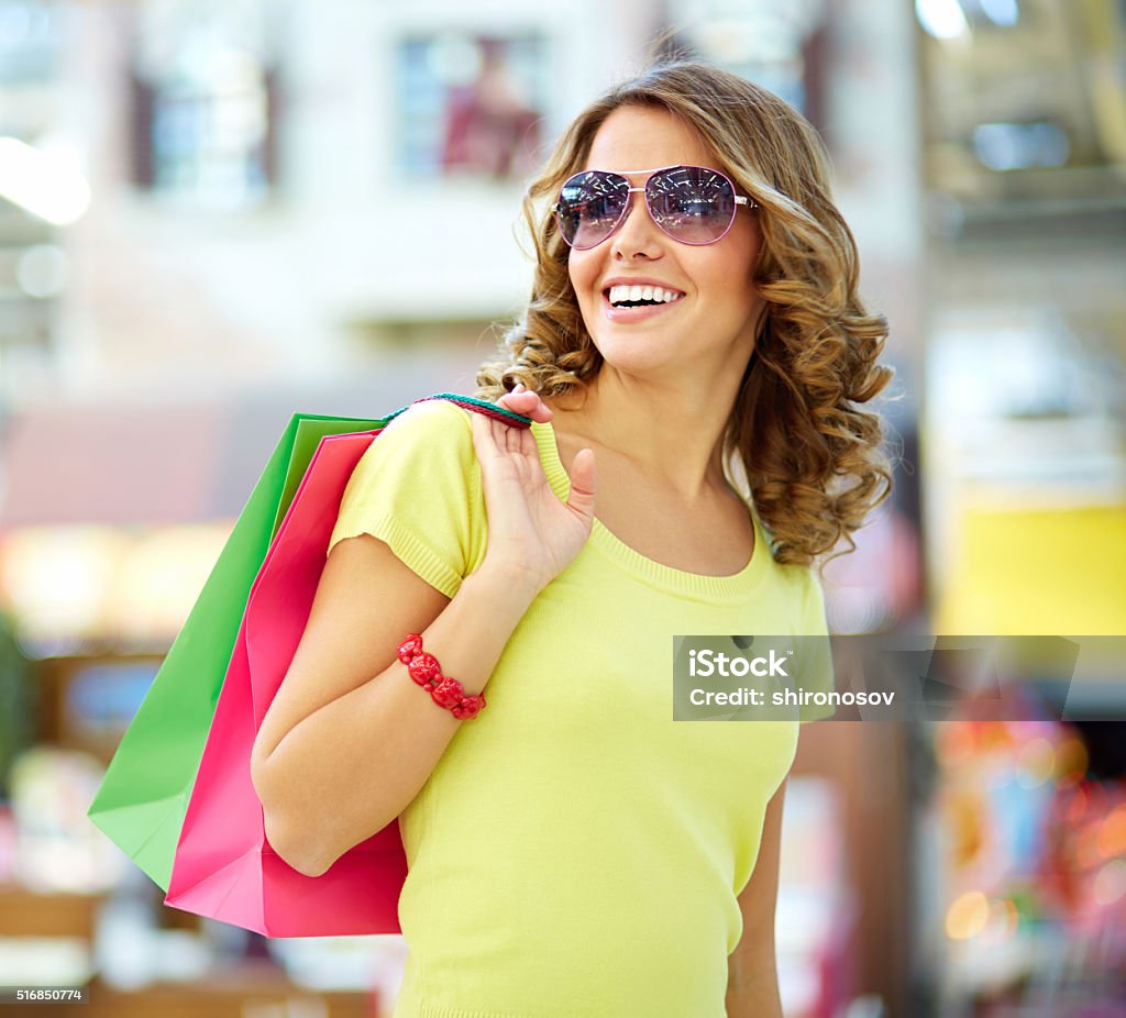 Carefree buyer Cool shopping girl enjoying a carefree weekend at mall Adult Stock Photo