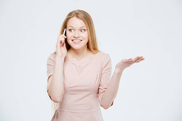 istock Smiling woman talking on the phone 516852154