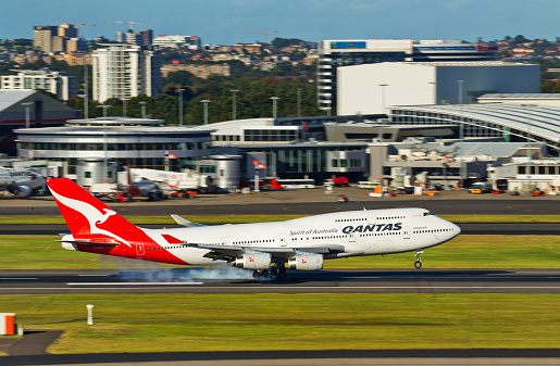 Sydney,Australia - March 19, 2016: A QANTAS Boeing 747  lands at the city's airport. A slow shutter speed was used to create motion blur.