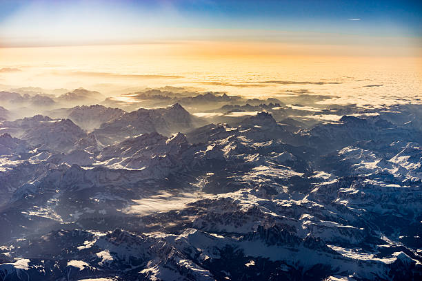 istock Alps in winter during sunrise, from the air 516853268