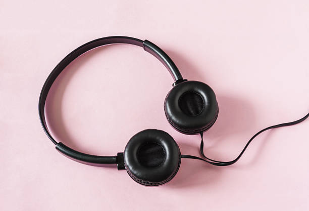 istock Headphones on pink paper color 516853364