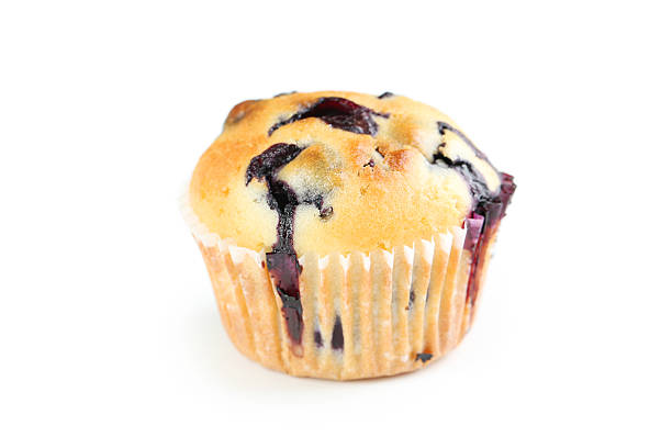 istock Tasty blueberry muffin isolated on a white 516854070