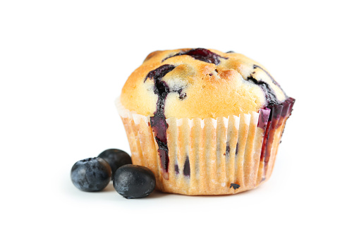 Tasty blueberry muffin isolated on a white