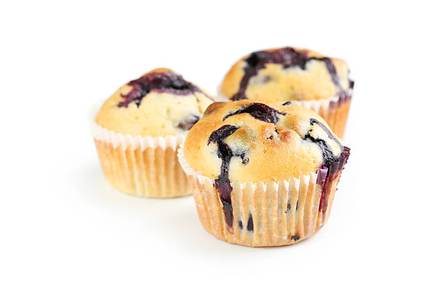 istock Tasty blueberry muffin isolated on a white 516854116