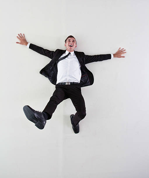istock Above view of businessman lying on floor 516871539