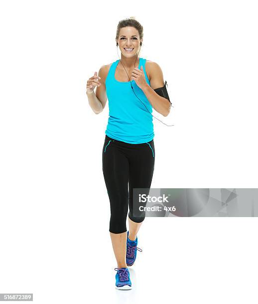 Cheerful Female Athlete Running Stock Photo - Download Image Now - Running, Women, White Background