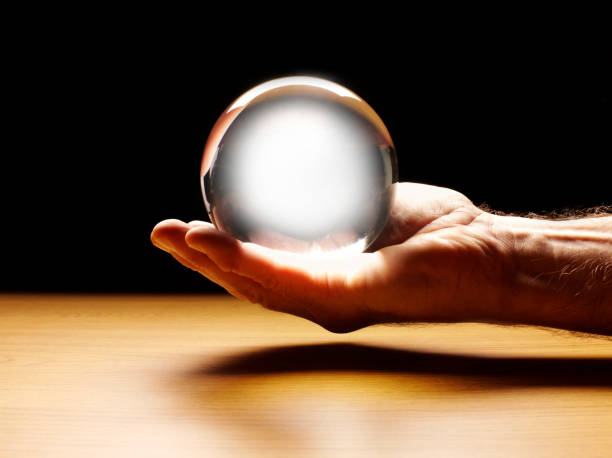 istock Male Hand with a Crystal Ball 516874369