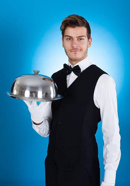 istock Confident Butler Carrying Tray 516874583