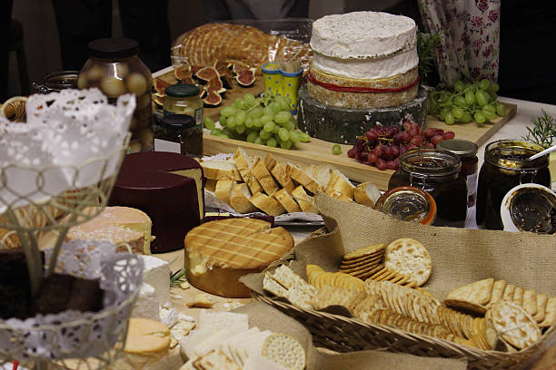 istock Cheese board with brie, Stilton, Cornish-Yarg, Cheddar, crackers, savoury biscuits 516875043
