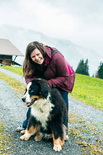 istock young woman playing with her dog 516875083