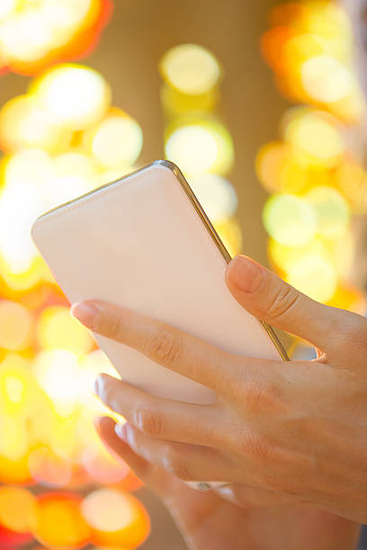 istock Focus hand holding smartphone 516875561