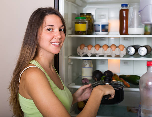 istock Woman near refrigerator 516876481