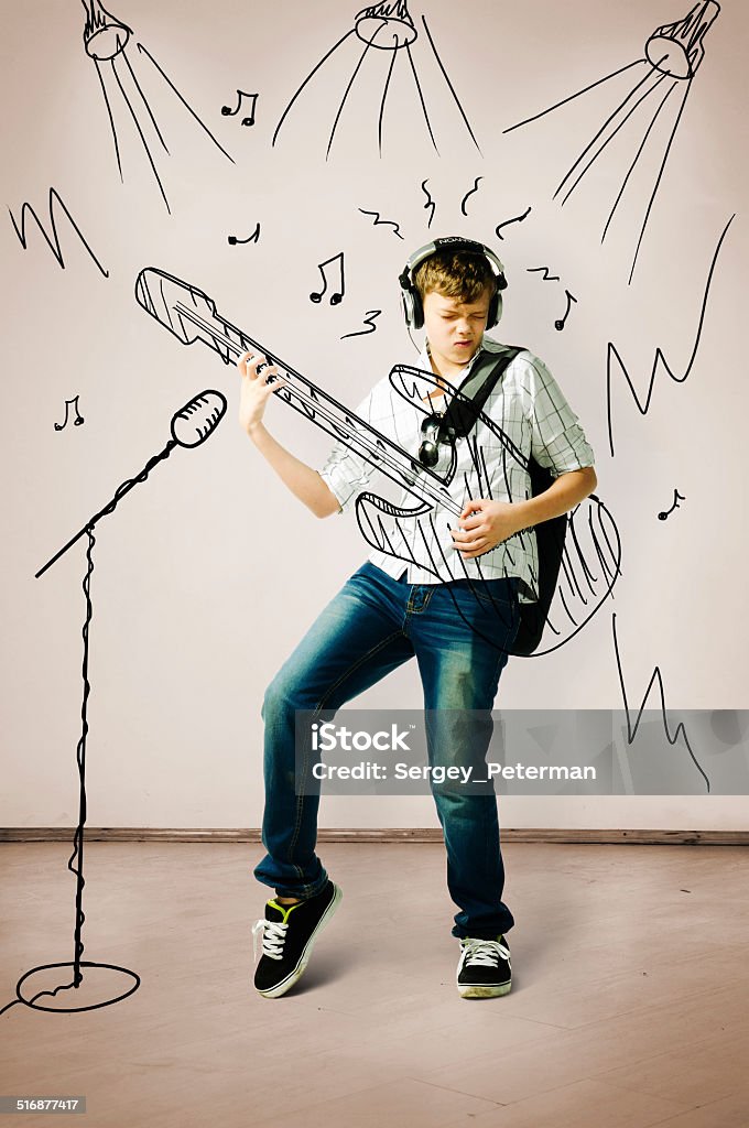 playing on drawn guitar teenager is playing on drawn guitar at concert Drawing - Activity Stock Photo