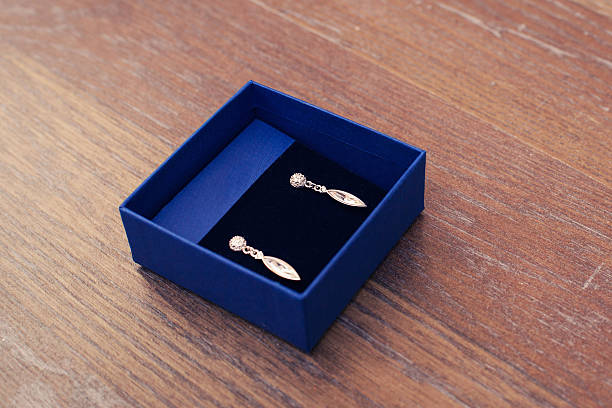 istock women's earrings in a blue box 516890080