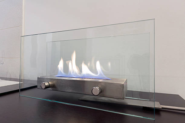 istock Portable glass fireplace on a desk 516895116